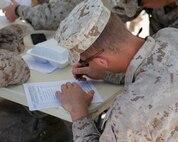 U.S. Marine Corps Cpl. Blake Cannon, a low altitude air defense gunner with 2nd Low Altitude Air Defense Battalion, Marine Air Control Group 28, 2nd Marine Air Wing signs a pre-exposure medical form before volunteering to participate in a tactical demonstration (TACDEMO) of the Active Denial System during Weapons and Tactics Instructor course (WTI) 2-17 at Site 50, Wellton, Ariz., April 4, 2017. The Aviation Development, Tactics and Evaluation Department and Marine Operational Test and Evaluation Squadron One (VMX-1) Science and Technology Departments conducted the TACDEMO to explore and expand existing capabilities. MAWTS-1 provides standardized advanced tactical training and certification of unit instructor qualifications to support Marine Aviation Training and Readiness and assist in developing and employing aviation weapons and tactics. (U.S. Marine Corps photo by Lance Cpl. Andrew M. Huff)