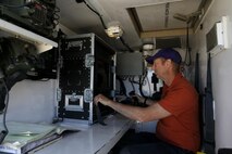 Mr. Paul Pelletier, senior engineer at the Joint Non-Lethal Weapons Directorate controls the Active Denial System (ADS) during Weapons and Tactics Instructor course (WTI) 2-17 at Site 50, Wellton, Ariz., April 4, 2017. The Aviation Development, Tactics and Evaluation Department and Marine Operational Test and Evaluation Squadron One (VMX-1) Science and Technology Departments conducted the tactical demonstration to explore and expand existing capabilities. MAWTS-1 provides standardized advanced tactical training and certification of unit instructor qualifications to support Marine Aviation Training and Readiness and assist in developing and employing aviation weapons and tactics. (U.S. Marine Corps photo by Lance Cpl. Andrew M. Huff)