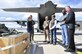 Staff Sgt. Meagan Hasty, left, a 39th Aerial Port Squadron technician, explains the ins-and-outs of rigging aerial delivery cargo before it is loaded onto a C-130 Hercules to community leaders during the Partners in Leadership visit at Peterson Air Force Base, Colo., March 23, 2017. The Partners in Leadership program is designed to grow and reinforce existing relations between leaders within the local community and the 302nd Airlift Wing and to further educate community leaders on the many Air Force Reserve missions performed in the Pikes Peak region. (U.S. Air Force photo/Staff Sgt. Frank Casciotta)