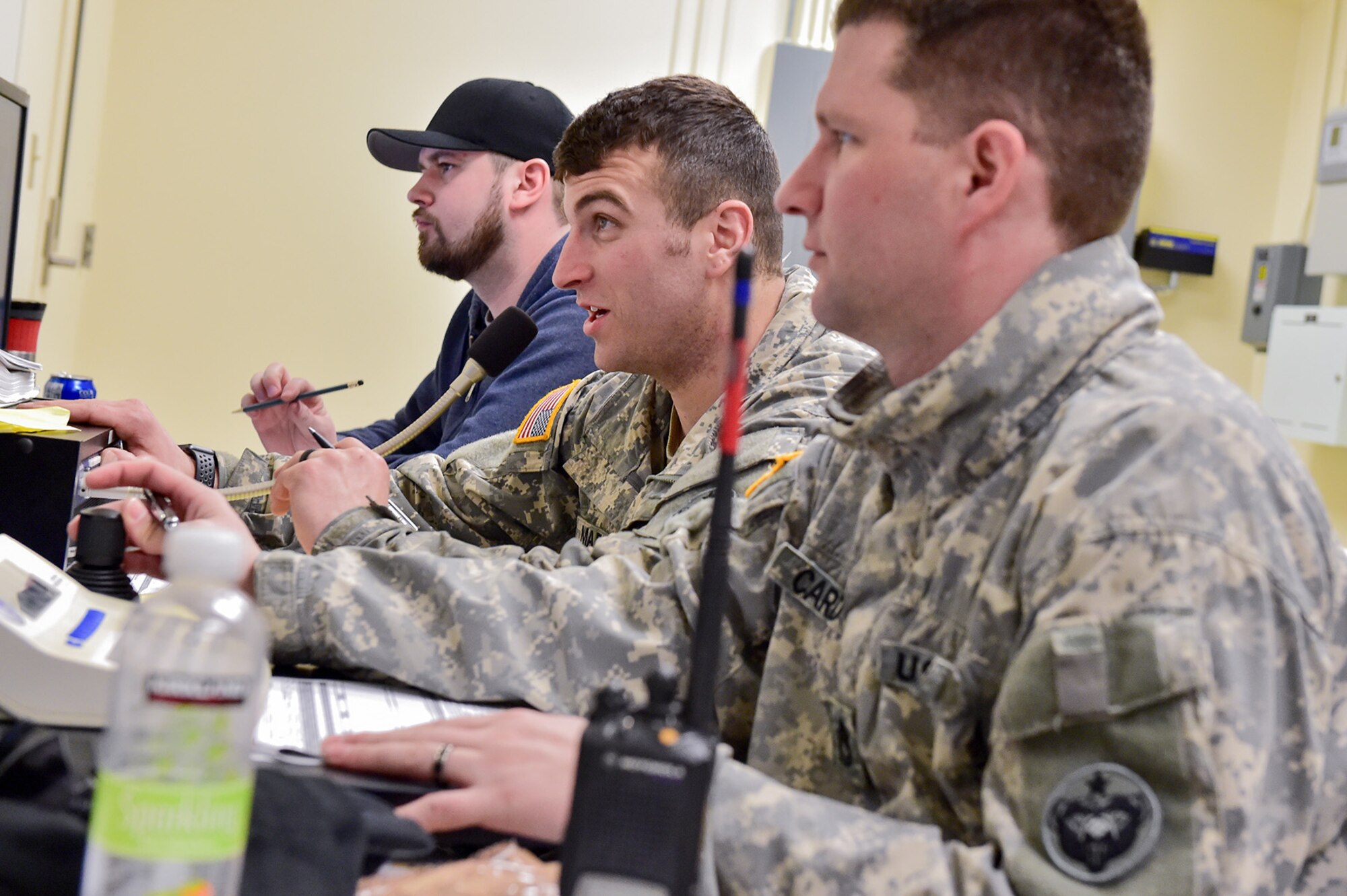 Rodney Lengele, left, a computer operator for the Multi Purpose Training Range, Army 2nd Lt. Jacob Maechler, and Army Sgt. 1st Class Justin Cardoza, both Soldiers assigned to the 95th Chemical Company, “Arctic Dragons”, 17th Combat Sustainment Support Battalion, U.S. Army Alaska, ensure the range is clear during a break in a gunnery live-fire exercise with M1135 Stryker Nuclear Biological Chemical Reconnaissance Vehicles on Joint Base Elmendorf-Richardson, Alaska, April 5, 2017.  The gunnery tested Soldier’s proficiency with identifying, engaging, and eliminating hostile targets while increasing combat effectiveness. The Styker NBCRV provides Nuclear, Biological, and Chemical detection and surveillance for battlefield visualization, and situational awareness to increase unit combat power.  The core of the NBCRV is its on-board integrated NBC sensor suite, and integrated meteorological system.  An NBC positive overpressure system minimizes cross-contamination of samples and detection instruments, provides crew protection, and allows extended operation at Mission Oriented Protective Posture. 
