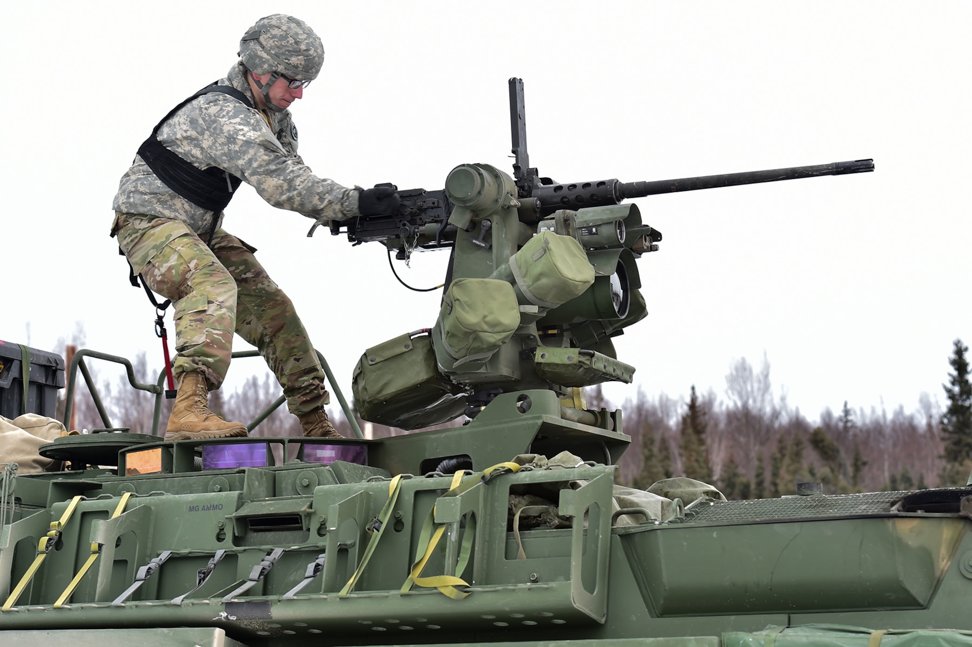 Spc. David Harper, a native of Johnstown, Ohio, assigned to the 95th Chemical Company, “Arctic Dragons”, 17th Combat Sustainment Support Battalion, U.S. Army Alaska, prepares to execute a gunnery live-fire exercise with M1135 Stryker Nuclear Biological Chemical Reconnaissance Vehicles on Joint Base Elmendorf-Richardson, Alaska, April 5, 2017.  The gunnery tested Soldier’s proficiency with identifying, engaging, and eliminating hostile targets while increasing combat effectiveness. The Styker NBCRV provides Nuclear, Biological, and Chemical detection and surveillance for battlefield visualization, and situational awareness to increase unit combat power.  The core of the NBCRV is its on-board integrated NBC sensor suite, and integrated meteorological system.  An NBC positive overpressure system minimizes cross-contamination of samples and detection instruments, provides crew protection, and allows extended operation at Mission Oriented Protective Posture.