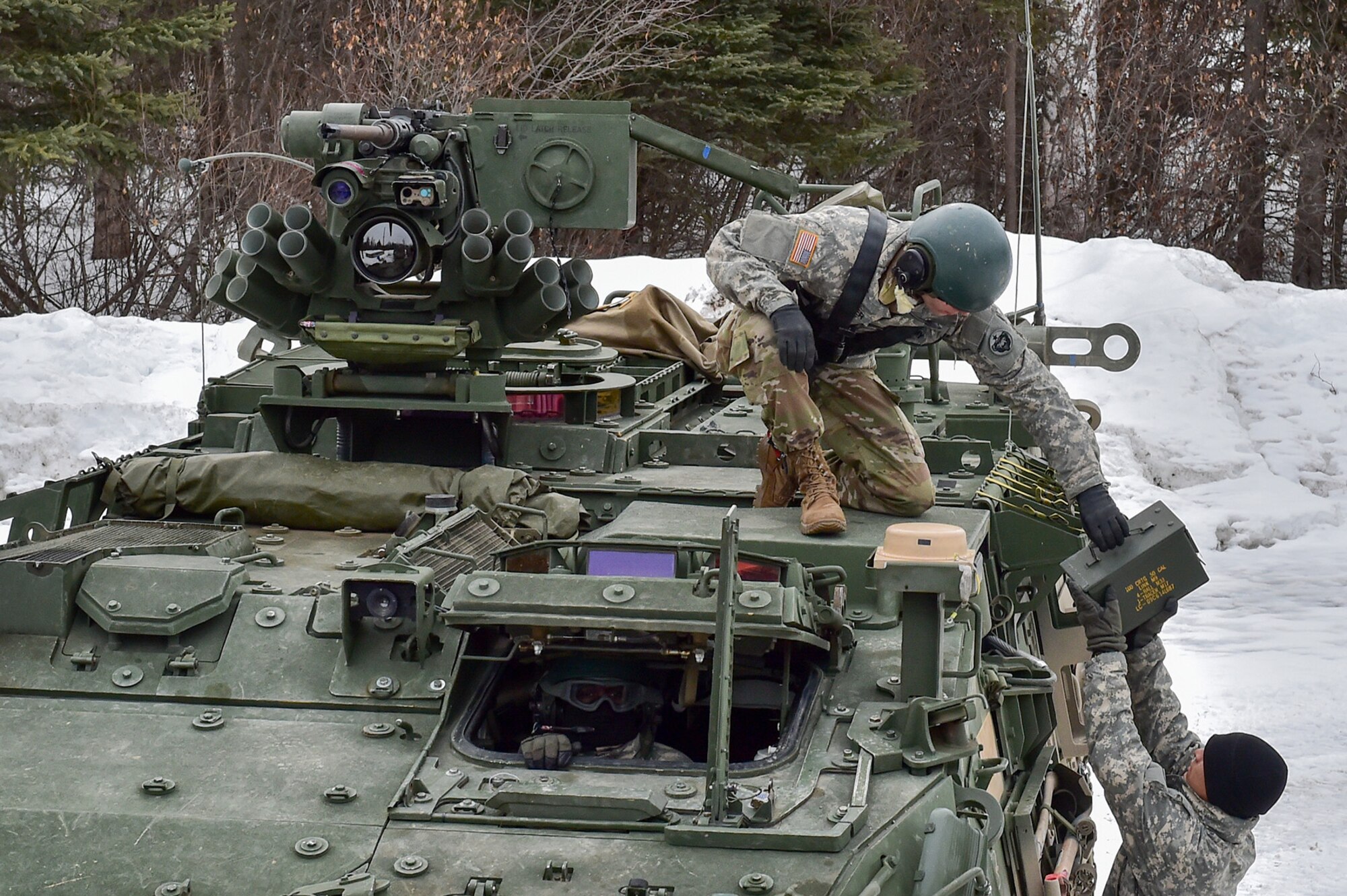 Soldiers assigned to the 95th Chemical Company, “Arctic Dragons”, 17th Combat Sustainment Support Battalion, U.S. Army Alaska, transfer ammunition at a supply point before a gunnery live-fire exercise with M1135 Stryker Nuclear Biological Chemical Reconnaissance Vehicles on Joint Base Elmendorf-Richardson, Alaska, April 5, 2017.  The gunnery tested Soldier’s proficiency with identifying, engaging, and eliminating hostile targets while increasing combat effectiveness. The Styker NBCRV provides Nuclear, Biological, and Chemical detection and surveillance for battlefield visualization, and situational awareness to increase unit combat power.  The core of the NBCRV is its on-board integrated NBC sensor suite, and integrated meteorological system.  An NBC positive overpressure system minimizes cross-contamination of samples and detection instruments, provides crew protection, and allows extended operation at Mission Oriented Protective Posture. 