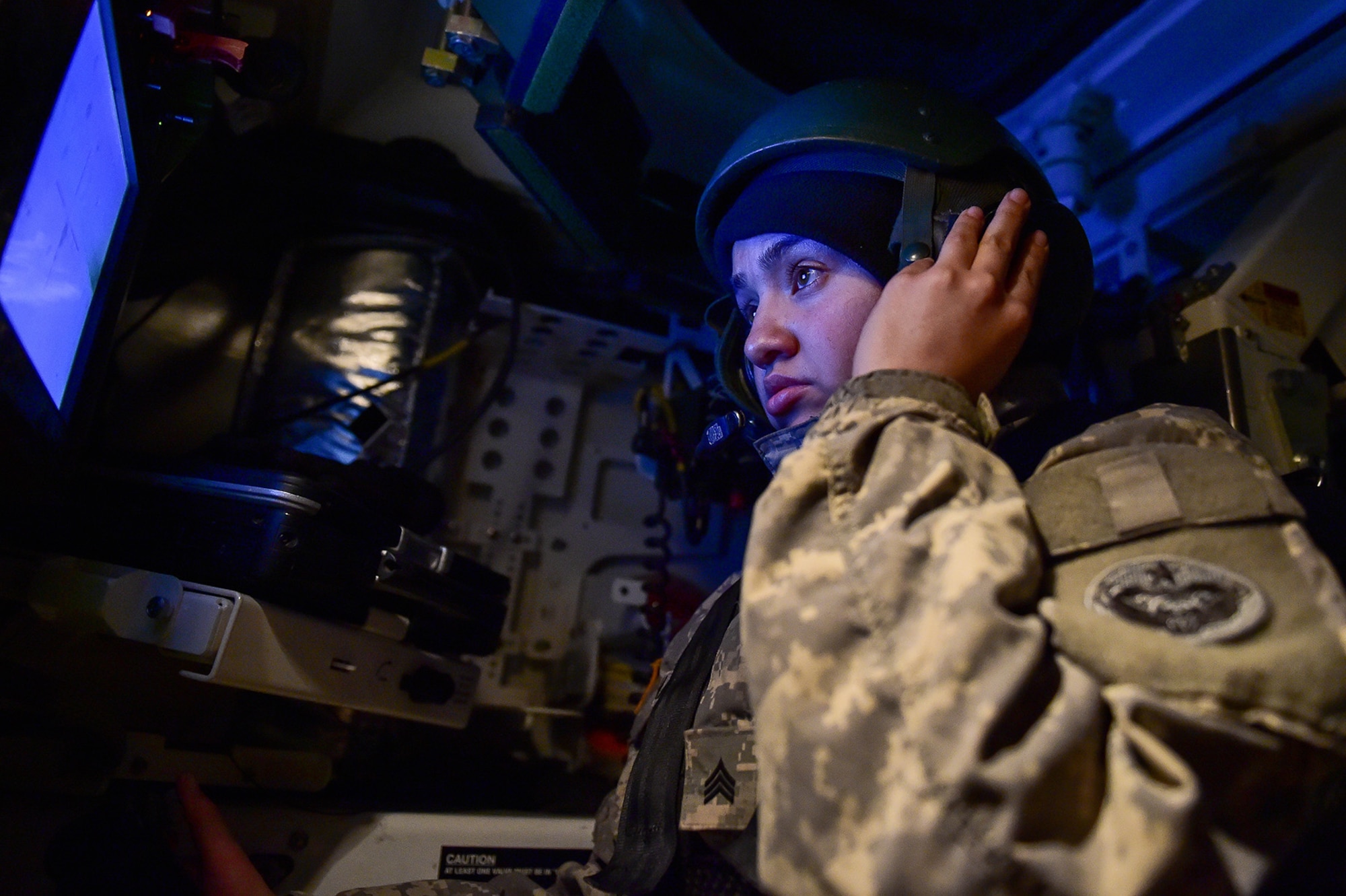 Army Sgt. Mayra Haynes, a native of Anaheim, Calif., assigned to the 95th Chemical Company, “Arctic Dragons”, 17th Combat Sustainment Support Battalion, U.S. Army Alaska, receives orders from her squad leader before engaging a target during a gunnery live-fire exercise with M1135 Stryker Nuclear Biological Chemical Reconnaissance Vehicles on Joint Base Elmendorf-Richardson, Alaska, April 5, 2017.  The gunnery tested Soldier’s proficiency with identifying, engaging, and eliminating hostile targets while increasing combat effectiveness. The Styker NBCRV provides Nuclear, Biological, and Chemical detection and surveillance for battlefield visualization, and situational awareness to increase unit combat power.  The core of the NBCRV is its on-board integrated NBC sensor suite, and integrated meteorological system.  An NBC positive overpressure system minimizes cross-contamination of samples and detection instruments, provides crew protection, and allows extended operation at Mission Oriented Protective Posture. 