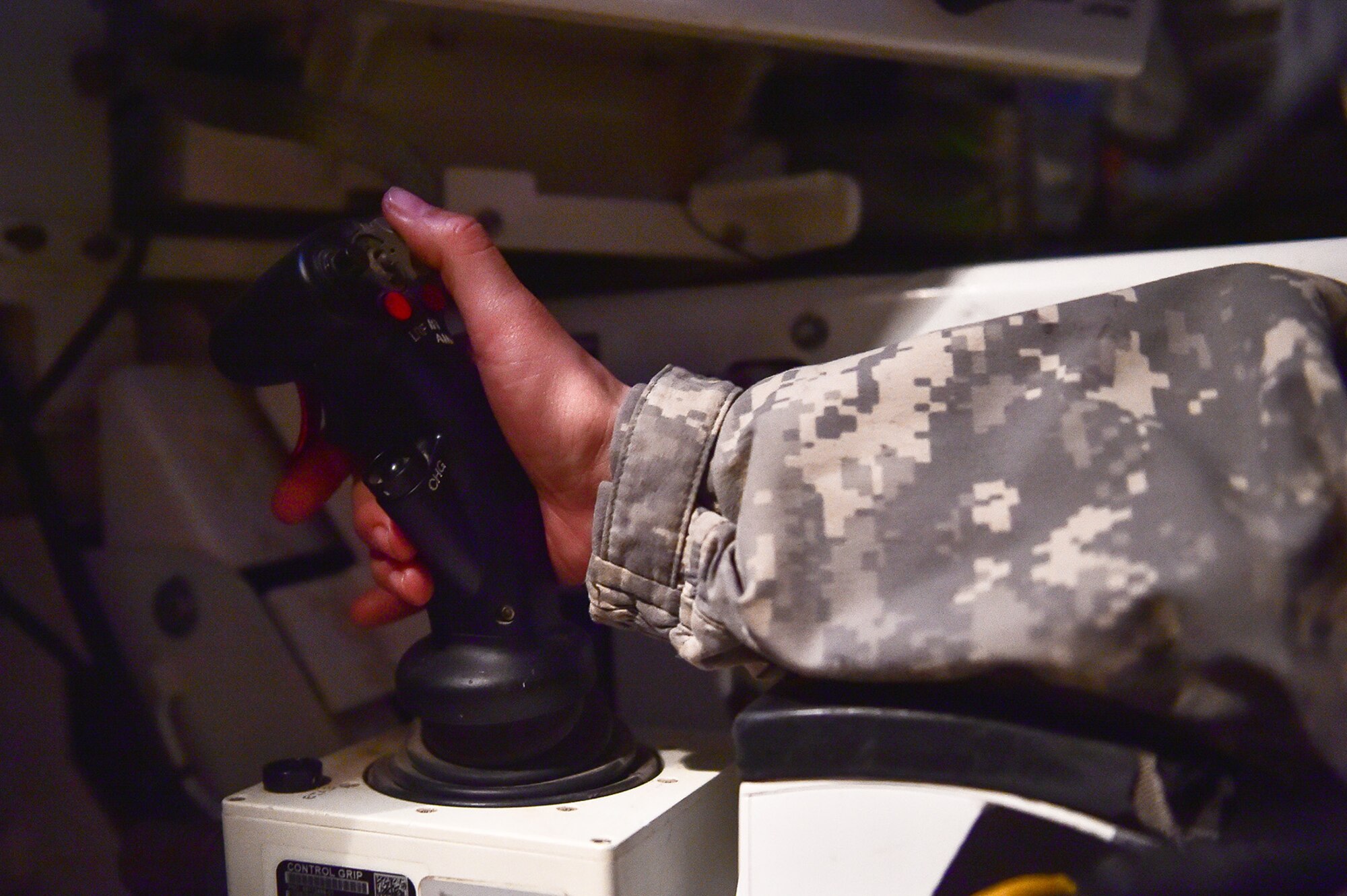 Army Sgt. Mayra Haynes, a native of Anaheim, Calif., assigned to the 95th Chemical Company, “Arctic Dragons”, 17th Combat Sustainment Support Battalion, U.S. Army Alaska, squeezes a trigger to fire her machine gun remotely during a gunnery live-fire exercise with M1135 Stryker Nuclear Biological Chemical Reconnaissance Vehicles on Joint Base Elmendorf-Richardson, Alaska, April 5, 2017.  The gunnery tested Soldier’s proficiency with identifying, engaging, and eliminating hostile targets while increasing combat effectiveness. The Styker NBCRV provides Nuclear, Biological, and Chemical detection and surveillance for battlefield visualization, and situational awareness to increase unit combat power.  The core of the NBCRV is its on-board integrated NBC sensor suite, and integrated meteorological system.  An NBC positive overpressure system minimizes cross-contamination of samples and detection instruments, provides crew protection, and allows extended operation at Mission Oriented Protective Posture. 
