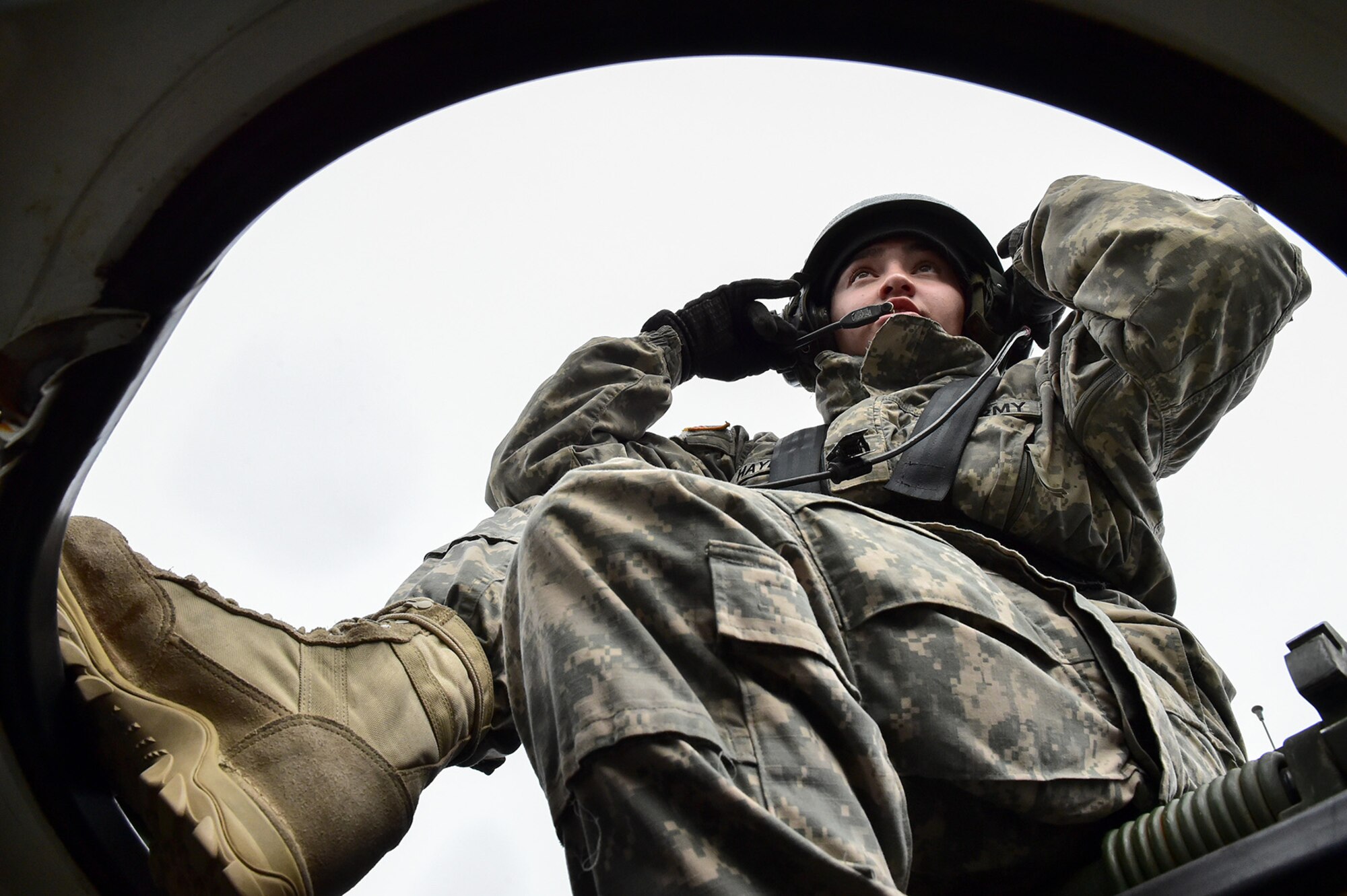 Army Sgt. Mayra Haynes, a native of Anaheim, Calif., assigned to the 95th Chemical Company, “Arctic Dragons”, 17th Combat Sustainment Support Battalion, U.S. Army Alaska, communicates with her squad leader after a gunnery live-fire exercise with M1135 Stryker Nuclear Biological Chemical Reconnaissance Vehicles on Joint Base Elmendorf-Richardson, Alaska, April 5, 2017.  The gunnery tested Soldier’s proficiency with identifying, engaging, and eliminating hostile targets while increasing combat effectiveness. The Styker NBCRV provides Nuclear, Biological, and Chemical detection and surveillance for battlefield visualization, and situational awareness to increase unit combat power.  The core of the NBCRV is its on-board integrated NBC sensor suite, and integrated meteorological system.  An NBC positive overpressure system minimizes cross-contamination of samples and detection instruments, provides crew protection, and allows extended operation at Mission Oriented Protective Posture.