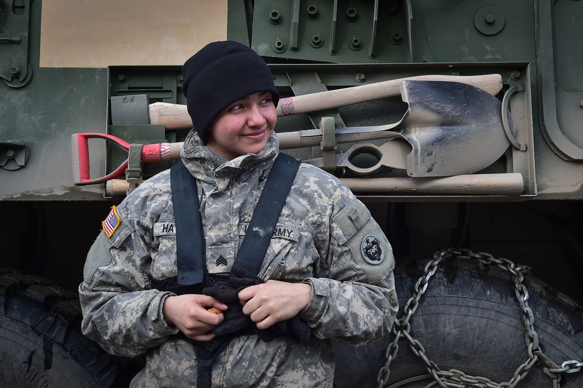 Army Sgt. Mayra Haynes, a native of Anaheim, Calif., assigned to the 95th Chemical Company, “Arctic Dragons”, 17th Combat Sustainment Support Battalion, U.S. Army Alaska, smiles at a fellow soldier’s joke during a break after a gunnery live-fire exercise with M1135 Stryker Nuclear Biological Chemical Reconnaissance Vehicles on Joint Base Elmendorf-Richardson, Alaska, April 5, 2017.  The gunnery tested Soldier’s proficiency with identifying, engaging, and eliminating hostile targets while increasing combat effectiveness. The Styker NBCRV provides Nuclear, Biological, and Chemical detection and surveillance for battlefield visualization, and situational awareness to increase unit combat power.  The core of the NBCRV is its on-board integrated NBC sensor suite, and integrated meteorological system.  An NBC positive overpressure system minimizes cross-contamination of samples and detection instruments, provides crew protection, and allows extended operation at Mission Oriented Protective Posture. 