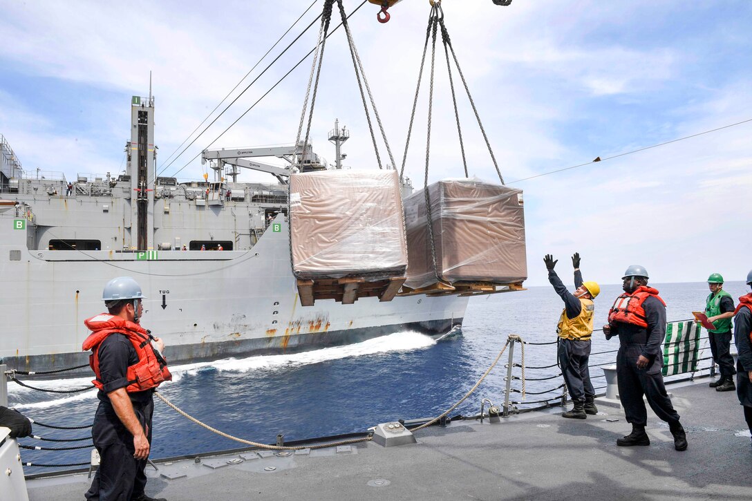 Sailors aboard the guided missile destroyer USS Wayne E. Meyer receive cargo from the dry cargo ship USNS Cesar Chavez during an underway replenishment in the South China Sea, April 3, 2017. Navy photo by Petty Officer 3rd Class Kelsey L. Adams