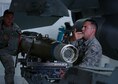 U.S. Air Force Airman 1st Class Brett Cerrone, 20th Aircraft Maintenance Squadron (AMXS) weapons load crew member, left, and Senior Airman Devin Borger, 20th AMXS weapons load crew chief, right, guide a team member driving a MJ-1 Lift Truck, or bomb loader, at Shaw Air Force Base, S.C., April 3, 2017. The loader is used to move munitions too heavy to safely carry by hand, such as the approximately 500 pound GBU-12 Paveway II laser-guided bomb. (U.S. Air Force photo by Airman 1st Class Kathryn R.C. Reaves)