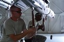 U.S. Air Force Senior Airman Alex Farides, left, and Senior Airman DaShawn Watts, right, 20th Aircraft Maintenance Squadron weapons load crew members, wire a GBU-12 Paveway II laser-guided bomb at Shaw Air Force Base, S.C., April 3, 2017. The wiring process takes crew members approximately ten minutes to complete. (U.S. Air Force photo by Airman 1st Class Kathryn R.C. Reaves)