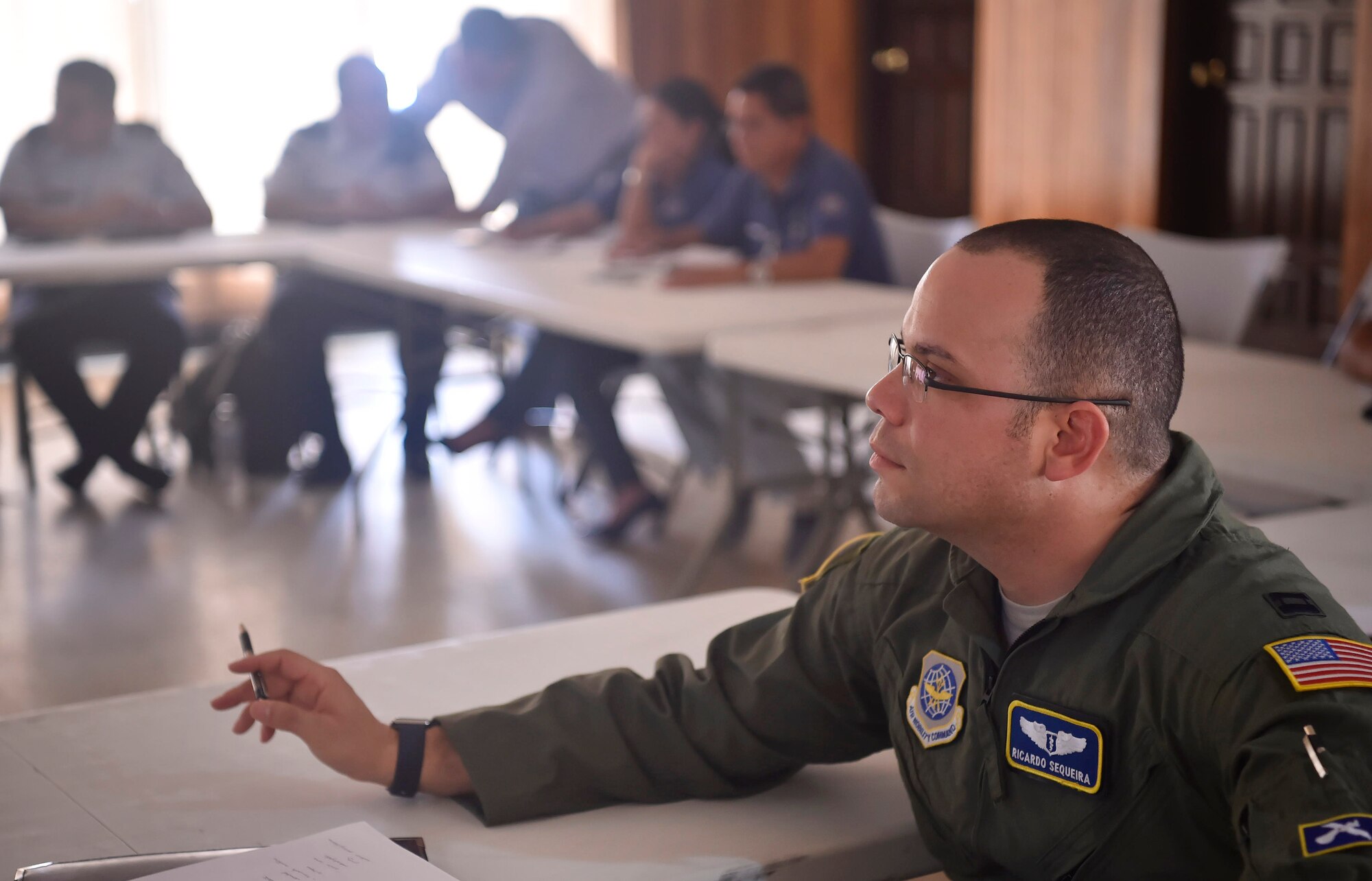 U.S. Air Force Capt. Ricardo Sequeira, 628th Medical Operations Support Squadron and 14th Airlift Squadron flight surgeon from Joint Base Charleston, South Carolina, participates in talks with members of the Honduran air force about flight medicine during an aerospace medicine subject matter expert exchange in Tegucigalpa, Honduras, April 4. The goal of the global health exchange is to share best practices, enhance relationships, and build partnership capacities.