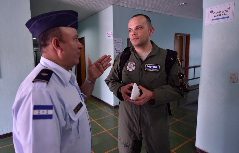 U.S. Air Force Capt. Ricardo Sequeira, 628th Medical Operations Support Squadron and 14th Airlift Squadron flight surgeon from Joint Base Charleston, South Carolina, right, tours a Honduran air force medical clinic during an aerospace medicine subject matter expert exchange in Tegucigalpa, Honduras, April 4. The goal of the global health exchange is to share best practices, enhance relationships, and build partnership capacities.