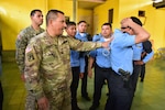 Staff Sgt. José Alequin, Joint Task Force-Bravo Joint Security Forces, shows participants how to properly immobilize a person during a Subject Matter Expert Exchange between JSF and local public forces in Comayagua.