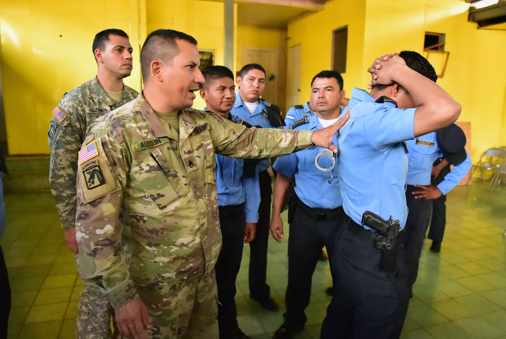 Staff Sgt. José Alequin, Joint Task Force-Bravo Joint Security Forces, shows participants how to properly immobilize a person during a Subject Matter Expert Exchange between JSF and local public forces in Comayagua.