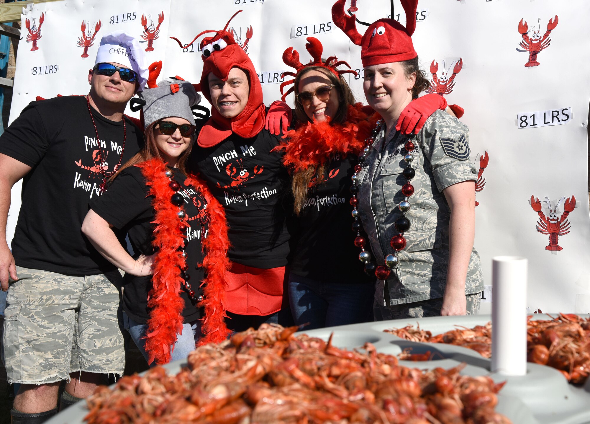 “Kajun Perfection” team members pose for a photo during the 5th Annual Bay Breeze Crawfish Cook-Off at the Bay Breeze Event Center April 7, 2017, on Keesler Air Force Base, Miss. The “Keesler Chiefs” won first place overall and a free entry into the 25th Annual Mississippi Coast Coliseum Crawfish Festival Cook-Off. (U.S. Air Force photo by Kemberly Groue)