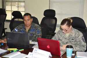 Sergeant Major Mario Ordoñez (left), Honduran Air Force Senior Enlisted Advisor and Master Sgt. Kristen Bamberger (right), JTF-Bravo Command Group Senior Enlisted Advisor, work together during a joint workshop on Soto Cano Air Base, March 23, 2017. The goal of the joint venture is to achieve a higher level of professionalism among local forces, using new teaching techniques that will allow them to pass on knowledge for future generations of soldiers across the Honduran armed forces.
