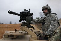 U.S. Army Reserve Sgt. 1st Class Mario Hernandez, 366th Engineer Company, 412th Theater Engineer Command steadies an MK19 automatic grenade launcher while his vehicle moves to the next battle position for blank fire during Operation Cold Steel at Fort McCoy, Wis., April 10, 2017. Operation Cold Steel is the U.S. Army Reserve's crew-served weapons qualification and validation exercise to ensure that America's Army Reserve units and Soldiers are trained and ready to deploy on short-notice and bring combat-ready and lethal firepower in support of the Army and our joint partners anywhere in the world. (U.S. Army Reserve photo by Staff Sgt. Debralee Best, 84th Training Command)