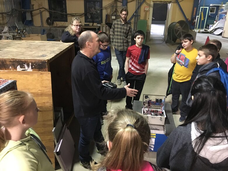 Blue Mountain Union School students recently visited the U.S. Army Engineer Research and Development Center’s Cold Regions Research and Engineering Laboratory as part of an education outreach program effort. Research Civil Engineer Leonard Zabilansky works throughout the year with the students in the classroom; the student’s CRREL visit helps solidify the classroom instruction. In the photo, CRREL Researcher Dr. Jim Lever talks with the students about the robots he has designed, built and deployed in both the Arctic and Antarctic.