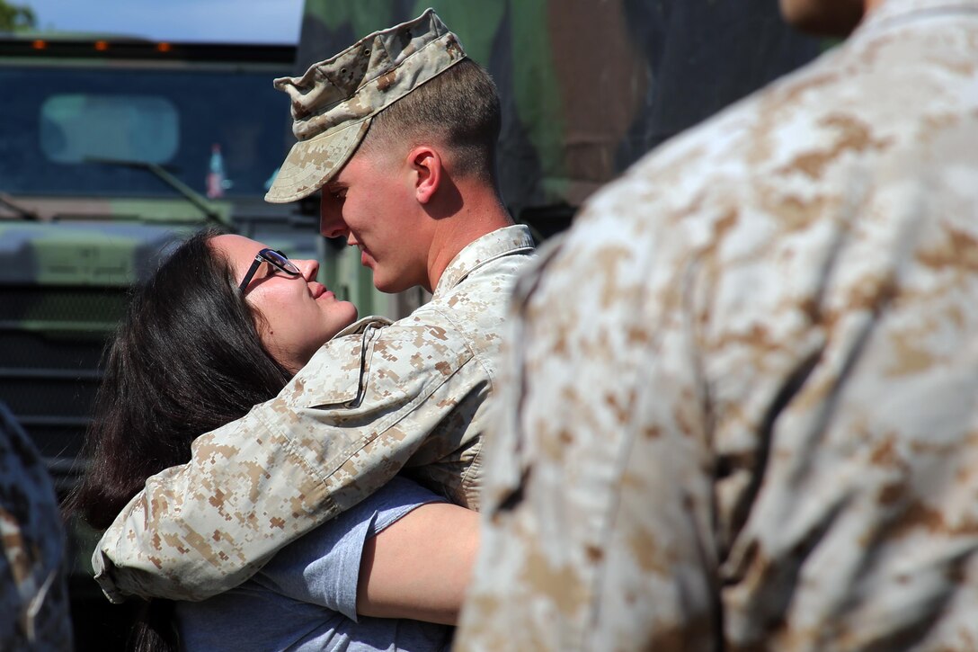 MARINE CORPS AIR STATION CHERRY POINT, N.C.—Lance Cpl. Adam Slama says goodbye to his wife before leaving for a deployment from Marine Corps Air Station Cherry Point, N.C., March 29, 2017. The mission of Marine Tactical Electronic Warfare Squadron 3, Marine Aircraft Group 14, 2nd Marine Aircraft Wing, during the deployment will be to conduct airborne electronic warfare in support of operations. This includes the EA-6B Prowler’s unique ability to suppress enemy radar and surface-to-air missiles utilizing electronic jamming and high-speed anti-radiation missiles, as well as collect tactical intelligence in a passive electronic support role. Slama is an electrician with Marine Wing Support Squadron 271, MAG-14, 2nd MAW. (U.S. Marine Corps photo by Cpl. Mackenzie Gibson/Released)