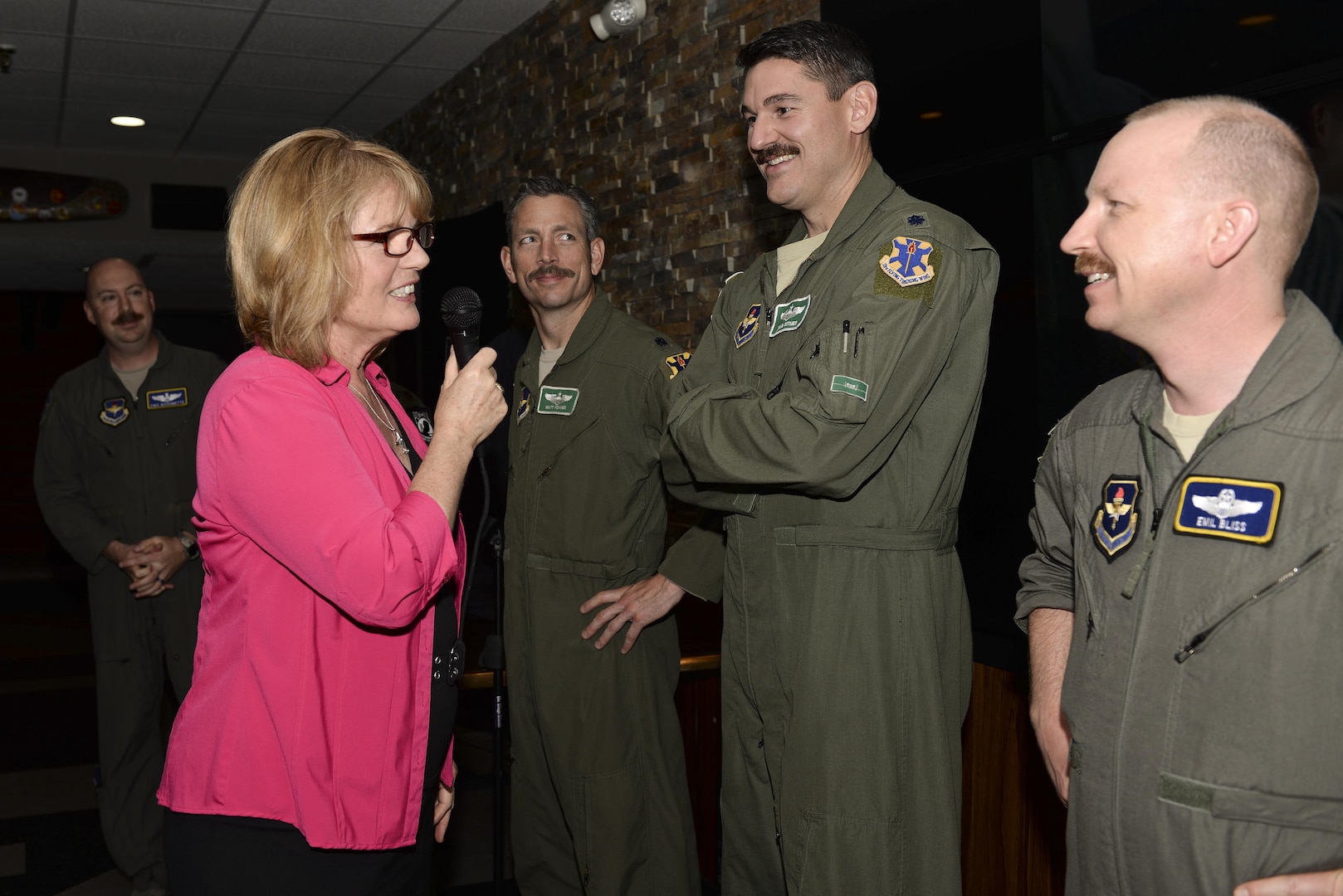 Christina Olds, daughter of retired Brig. Gen. Robin Olds, examines mustaches to determine the one that best conveys her father’s legendary spirit at the Auger Inn on Joint Base San Antonio-Randolph, Texas, March 30, 2017. Olds visit was part of the activities for the 44th Freedom Fighters Reunion honoring POW/MIA pilots. (U.S. Air Force photo by Staff Sgt. Michelle Patten)