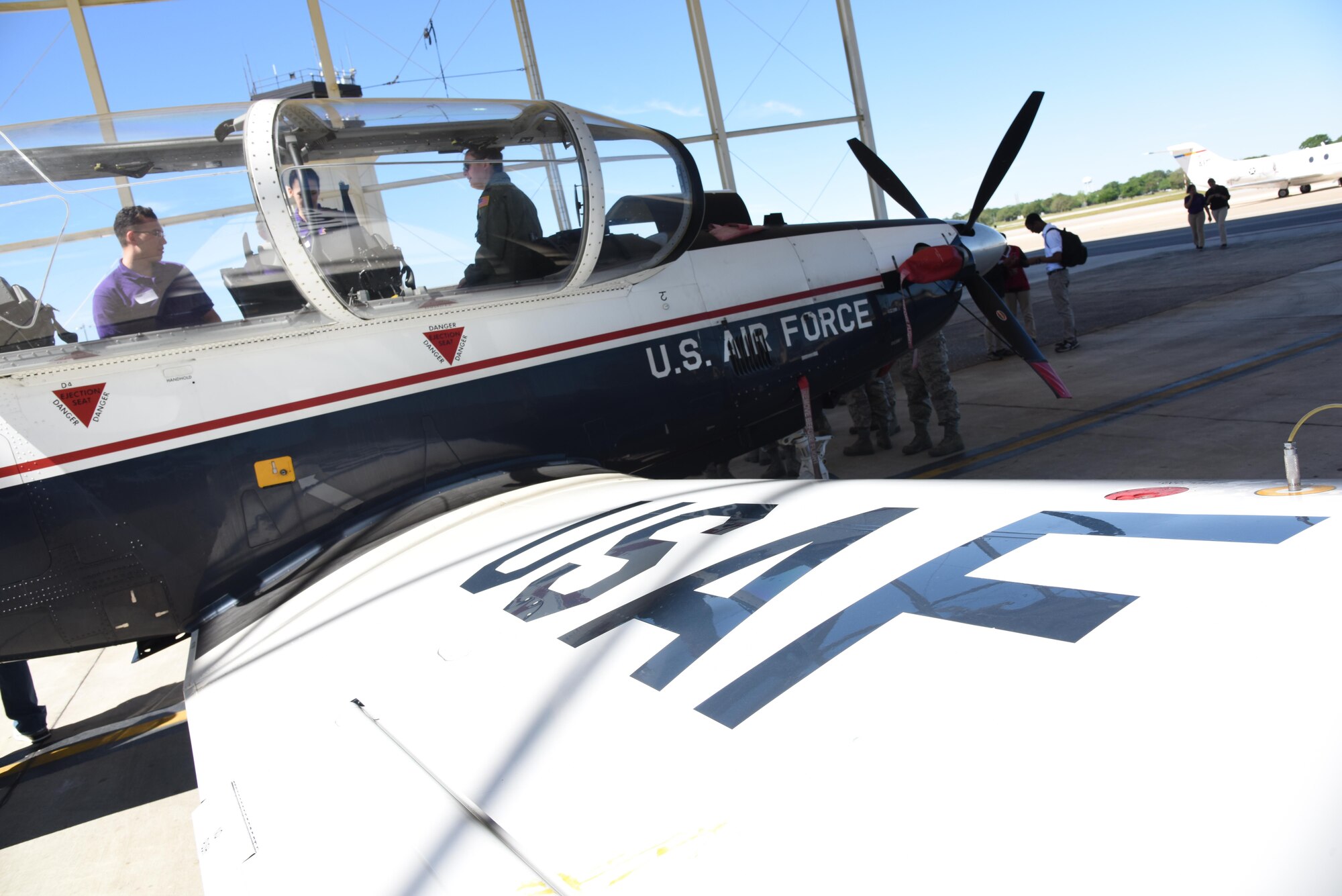 Air Force ROTC cadets view a T-6 Texan 2 static display during Pathways to Blue April 7, 2017, on Keesler Air Force Base, Miss. Pathways to Blue, an annual event hosted by 2nd Air Force with the support of the 81st Training Wing and the 403rd Wing, allowed cadets to receive hands-on briefings with technical and flying operations and an orientation flight in support of the Air Force's Diversity Strategic Roadmap program. (U.S. Air Force photo by Kemberly Groue)