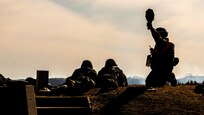 U.S. Army Reserve range operations Soldier signifies to the tower that his crew is ready for ground qualification during Operation Cold Steel at Fort McCoy, Wis., April 2, 2017. Operation Cold Steel is the U.S. Army Reserve's crew-served weapons qualification and validation exercise to ensure that America's Army Reserve units and Soldiers are trained and ready to deploy on short-notice and bring combat-ready and lethal firepower in support of the Army and our joint partners anywhere in the world. (U.S. Army Reserve photo by Spc. Maurice Cheeks, 319th Medical Detachment)