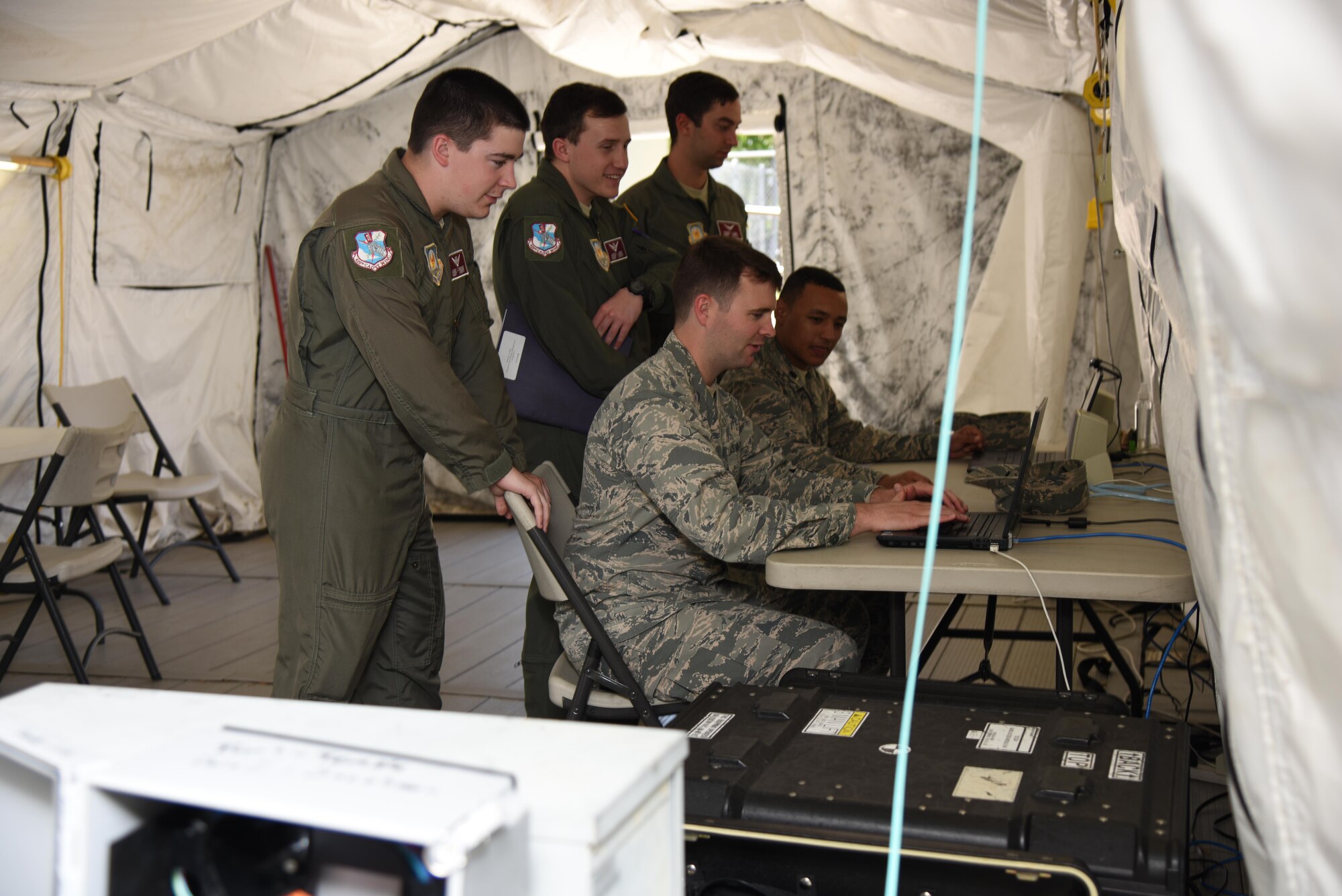 Air Force ROTC cadets simulate troubleshooting on an expeditionary network for the cyber transport systems career field during Pathways to Blue April 7, 2017, on Keesler Air Force Base, Miss. Pathways to Blue is a diversity and inclusion outreach event hosted by 2nd Air Force with the support of the 81st Training Wing and the 403rd Wing. The event provided the 178 cadets who traveled here from seven detachments a chance to interact with officers from 36 different specialties from across the Air Force. (U.S. Air Force photo by Kemberly Groue)

