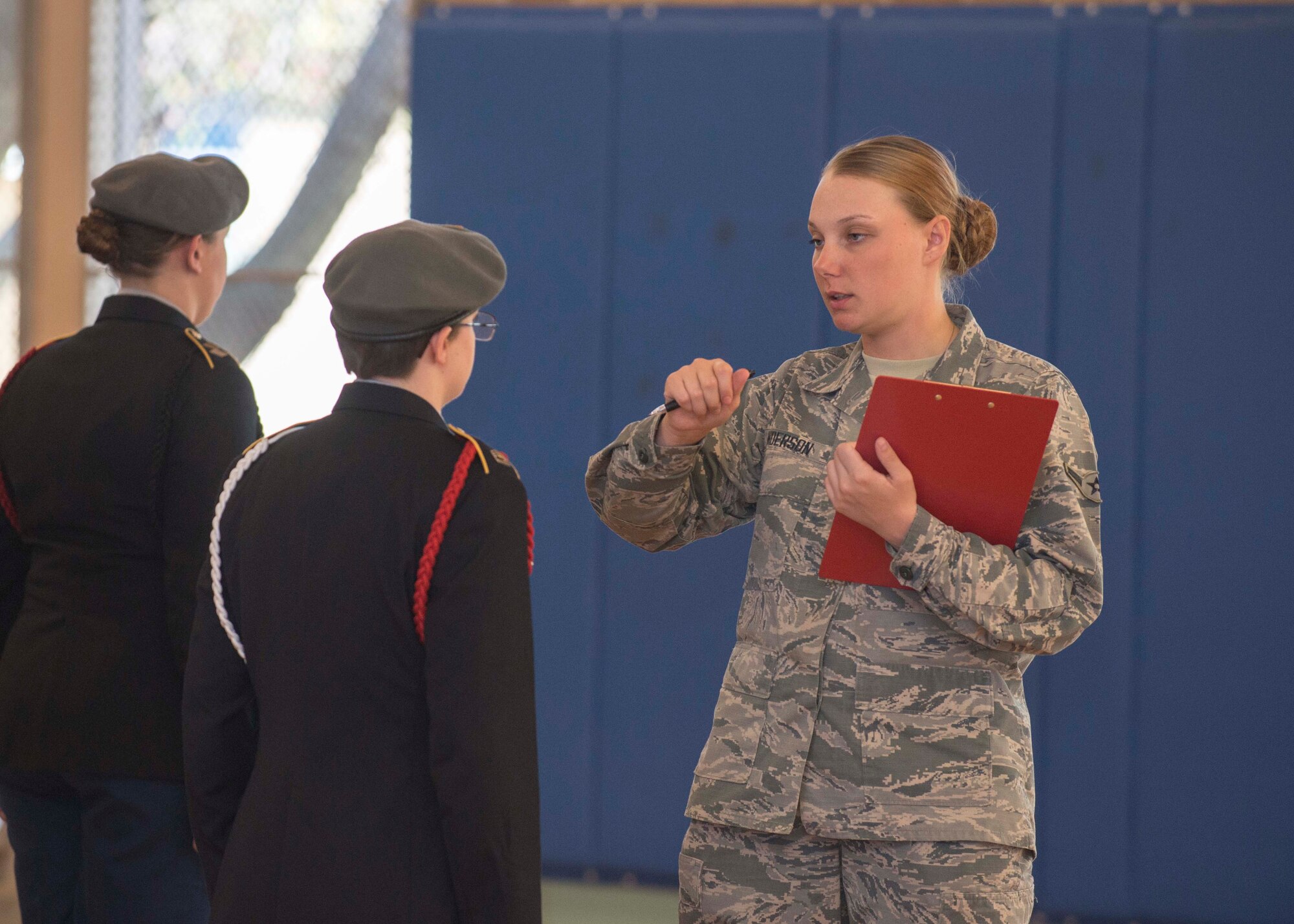 Airman Natasha Anderson, Air Force ceremonial guardsman, inspects a Sussex Technical School Junior Reserve Officer Training Corps cadet during the 2017 Delaware State JROTC Drill Competition April 8, 2017, on Dover Air Force Base, Del. Judges were made up of recruiters from different branches and members of the Air Force Honor Guard and Dover AFB. (U.S. Air Force photo by Staff Sgt. Jared Duhon)
