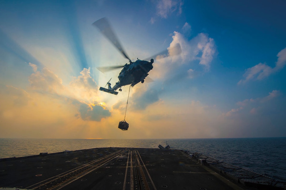 MH-60R Sea Hawk helicopter assigned to Vipers of Helicopter Maritime Strike Squadron 48 conducts vertical replenishment training aboard guided-missile cruiser USS Monterey, Gulf of Oman, November 21, 2016 (U.S. Navy/William Jenkins)