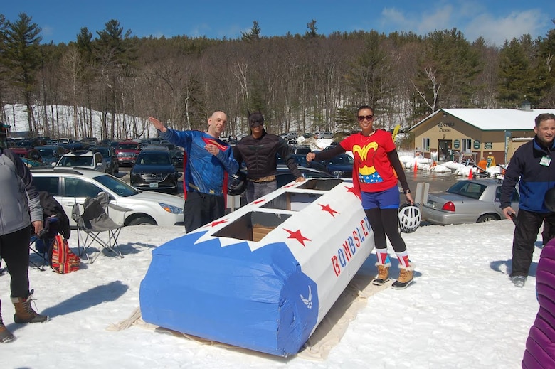 Fred Dutton, James Boyd and Searra Peck show off their “Bombsled” before the Intergalactic Cardboard Sled Race at Mount Sunapee, Newbury, New Hampshire, Sunday, April 2, 2017.  The race helps fund a home that supports children cancer patients. (Courtesy photo)
