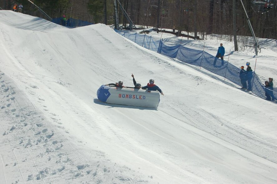 Team 23rd Space Operations Squadron finish the Intergalactic Cardboard Sled Race at Mount Sunapee, Newbury, New Hampshire, Sunday, April 2, 2017. The race is held annually, and the sleds are judged in two categories: artistry and construction. (Courtesy photo)