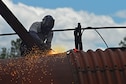 John Straka, contractor, repairs steel on top of an aircraft fire trainer at Shaw Air Force Base, S.C., April 6, 2017. The aircraft fire trainer allows 20th Civil Engineer Squadron firefighters to maintain their readiness to stop aircraft fires. (U.S. Air Force photo by Airman 1st Class Destinee Sweeney)