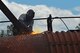 John Straka, contractor, repairs steel on top of an aircraft fire trainer at Shaw Air Force Base, S.C., April 6, 2017. The aircraft fire trainer allows 20th Civil Engineer Squadron firefighters to maintain their readiness to stop aircraft fires. (U.S. Air Force photo by Airman 1st Class Destinee Sweeney)