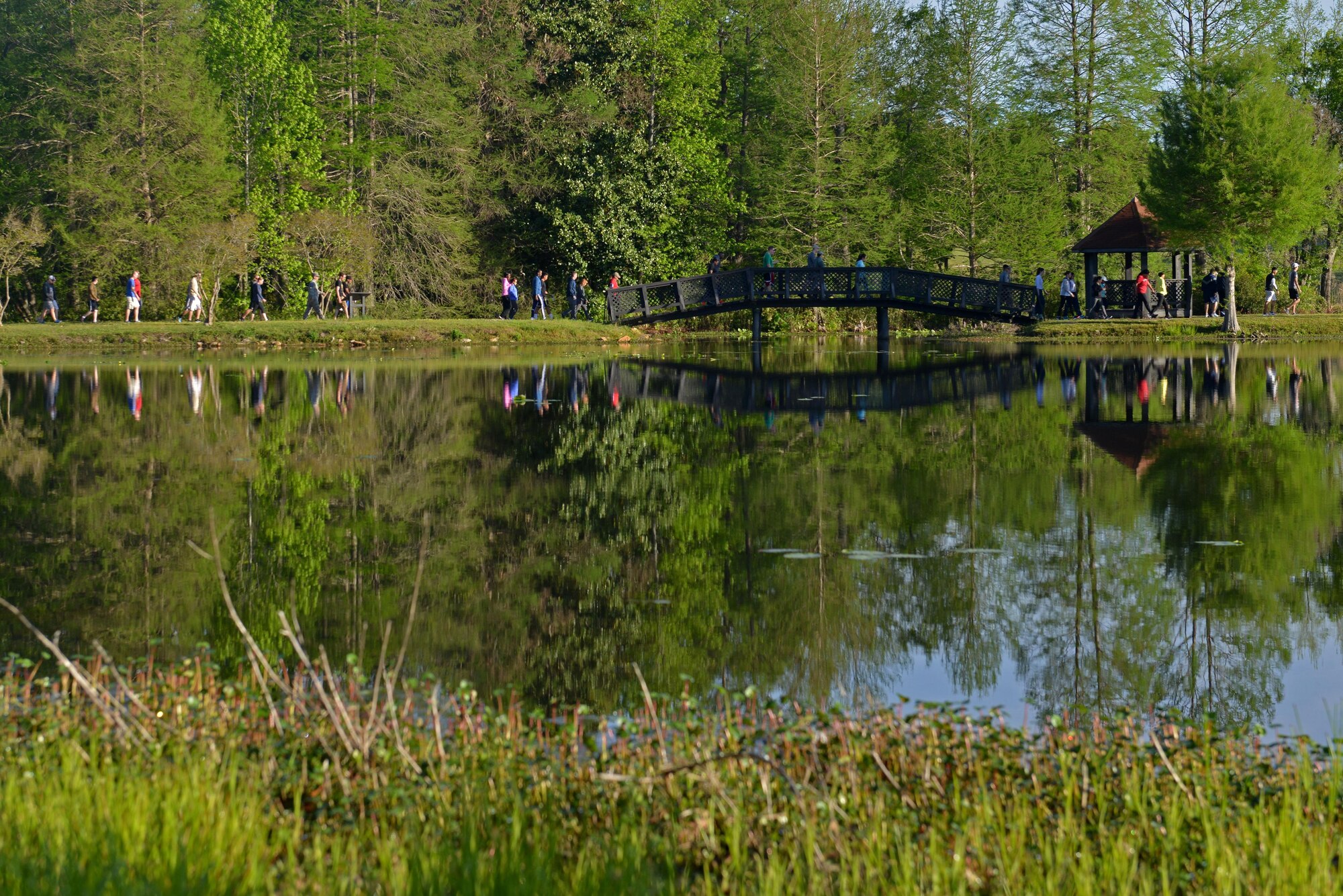 Team Shaw members participate in the Weasel Walk around Memorial Lake at Shaw Air Force Base, S.C., April 10, 2017. More than 100 Team Shaw members gathered to raise money for their fellow Airmen during the kick-off event for the Air Force Assistance Fund campaign. (U.S. Air Force photo by Airman 1st Class Destinee Sweeney)