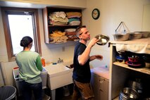 (From left) Airman 1st Class Habeebee Velazquez-Campos and Senior Airman Frederick Vogelgesan, both  5th Logistics Readiness Squadron vehicle maintainers, wash dog and cat bowls at Souris Valley Animal Shelter in Minot, N.D., March 29, 2017. Airmen volunteered two hours to help clean, organize and take care of the animals at the shelter. (U.S. Air Force photo/Airman 1st Class Dillon J. Audit) 