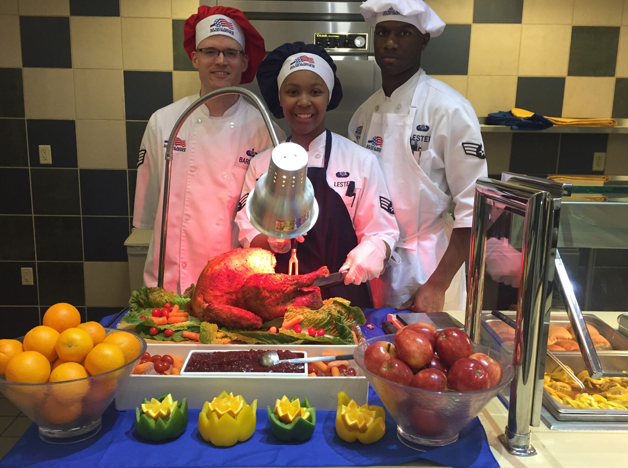 Staff Sgt. Dustin Barret (from left) and Senior Airmen Harri Lester and  D'Travian Lester showcase their skills at the award-winning dining facility on Little Rock Air Force Base, Arkansas. The facility won the 2017 John L. Hennessy Award in Region 1 (East) for best food service operation in the U.S. Air Force. (Courtesy photo/Harold Ritchie)