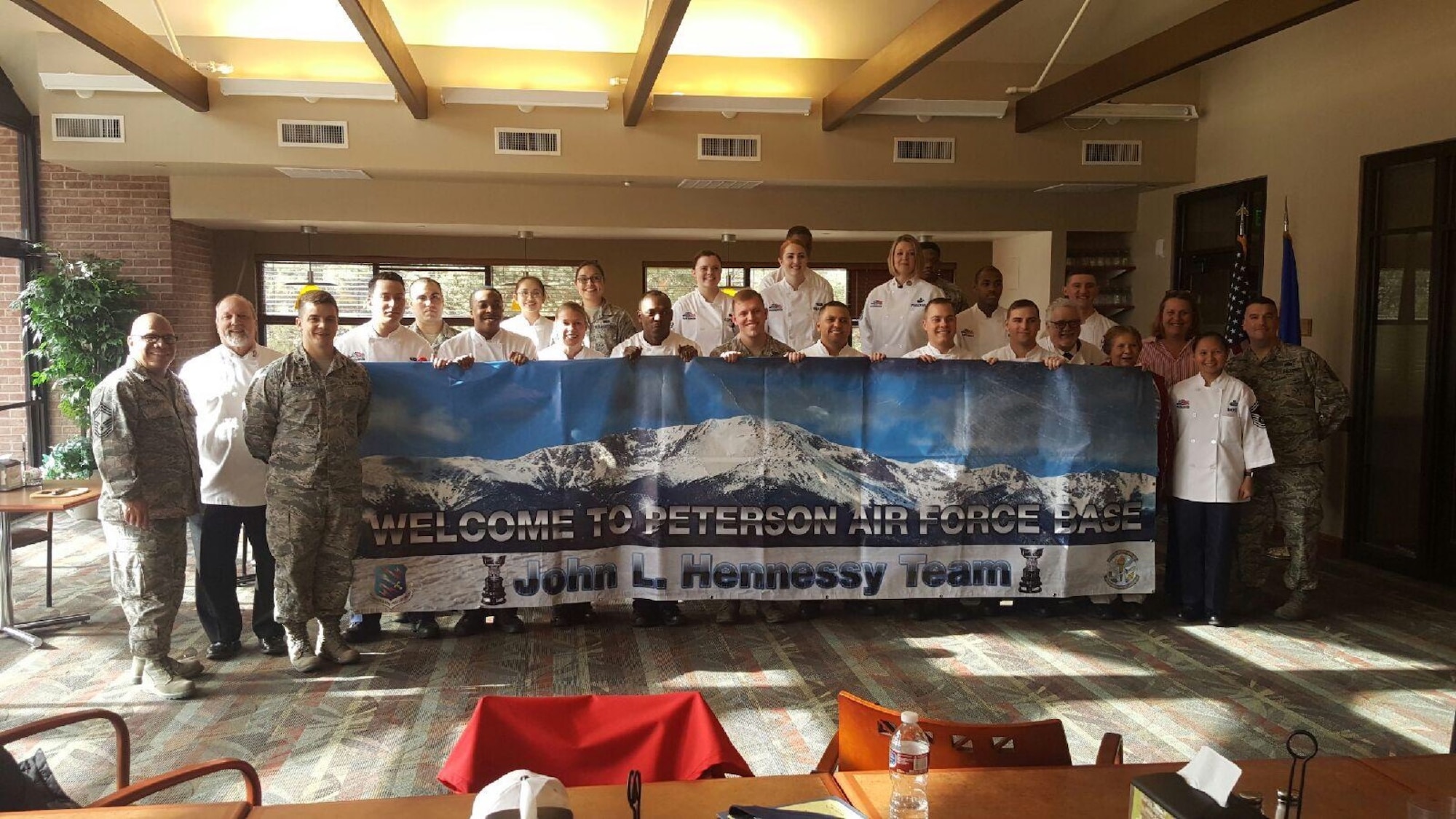 Airmen from the dining facility on Peterson Air Force Base, Colorado, welcome the Hennessy Travelers, who studied all aspects of their operation Feb. 27-28. Peterson was chose as the best U.S. Air Force food service operation in Region 2. (Courtesy photo)