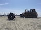 Tractors and other beach equipment are in place to assemble the pipes necessary to transport the dredged material from the Oceanside Harbor entrance channel to renourish the city's shoreline, improving recreational opportunities and increasing protection for homes and businesses on the shore.