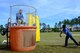 U.S. Air Force Lt. Col. William Clayton, 20th Force Support Squadron commander, left, falls into a tank of water after a Team Shaw child hits a target with a ball during a Month of the Military Child (MOMC) celebration at Shaw Air Force Base, S.C., April 8, 2017. The MOMC was first recognized in 1986 to show support for military children and highlight the sacrifices they make while their parents serve. (U.S. Air Force photo by Airman 1st Class Kathryn R.C. Reaves)