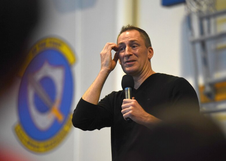 Ben Bailey jokes with the audience during his comedy performance at Schriever Air Force Base, Colorado, Wednesday, April 5, 2017. Bailey is best known for being the host of “Cash Cab”, a popular trivia show. The event was provided through Air Force Entertainment, an organization which helps bring morale focused events to Air Force bases, and the 50th Force Support Squadron. Volunteers were also present, providing free food and beverages to attendees.  (U.S Air Force photo/Airman 1st Class William Tracy)