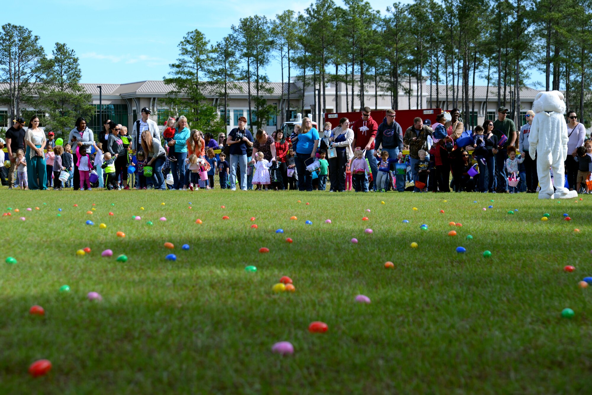 Team Shaw members gather before an egg hunt during a Month of the Military Child celebration at Shaw Air Force Base, S.C., April 8, 2017. Children participating in the hunt were given the opportunity to socialize with other children their age while also spending time having fun with family members. (U.S. Air Force photo by Airman 1st Class Kathryn R.C. Reaves)