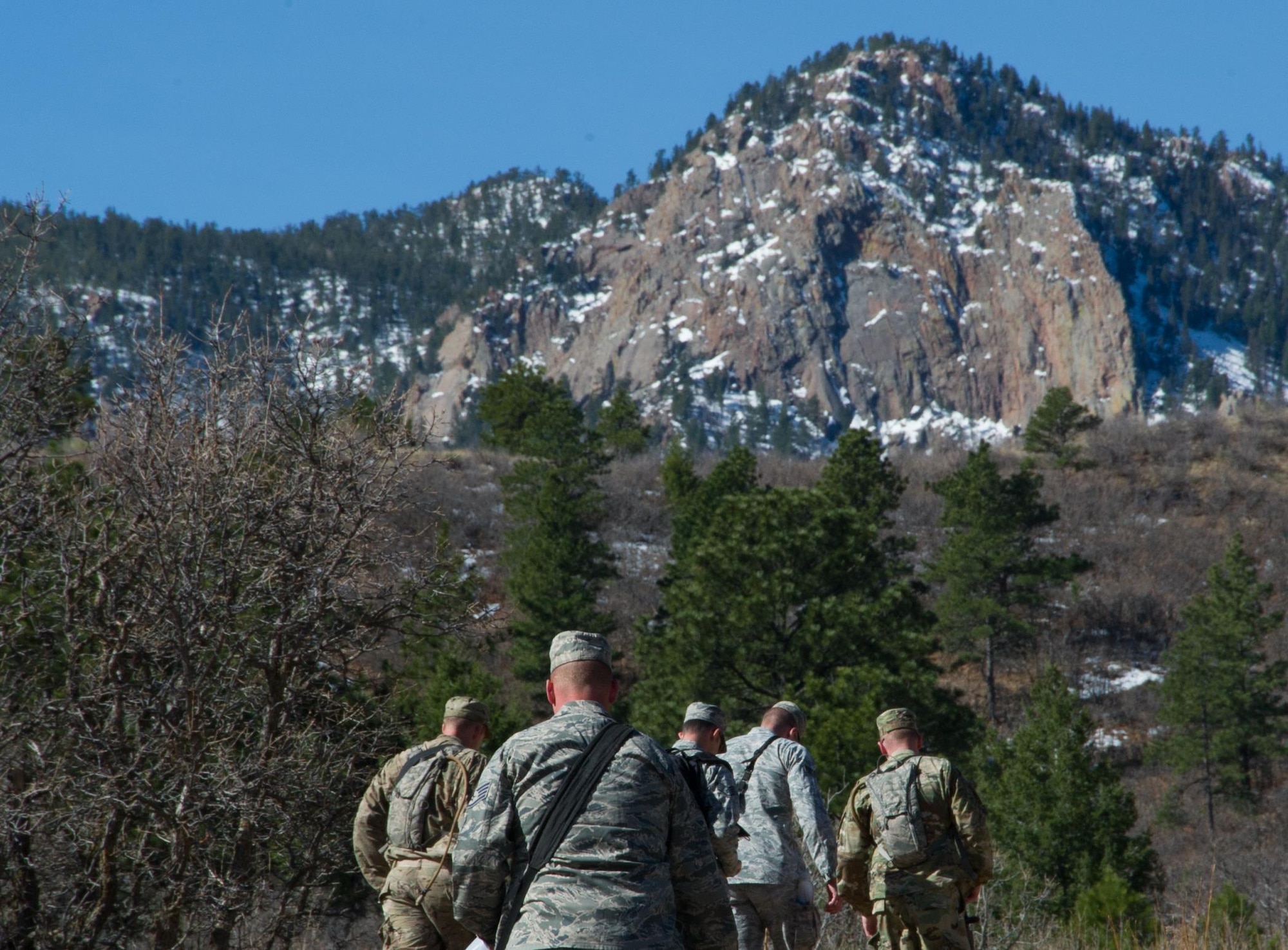 SCHREIVER AIR FORCE BASE, Colo. -- After conducting drills to prepare for their day, Security Forces Airmen head back to camp to gear up for a practice combat situation during the 2017 Reduced Combat Leaders Course, held at the U.S. Air Force Academy in Colorado, on Friday, Apr. 7th, 2017. The course provides seven days of classroom and field training exercises that focus on developing combat leadership skills of junior non-commissioned officers and company grade officers in the Security Forces career field. (U.S. Air Force photo/Senior Airman Laura Turner)
