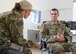 SCHREIVER AIR FORCE BASE, Colo. -- Tech. Sgt. Jennifer Arney, Non-commissioned Officer in Charge of Reduced Combat Leaders Course (R-CLC) for 710th Security Force Squadron, briefs Maj. Thomas Sebastiani, 710th SFS operations officer, on individuals injured during training at the 2017 R-CLC, U.S. Air Force Academy, Colorado, on Friday, Apr. 7th, 2017. The course provides seven days of classroom and field training exercises that focus on developing combat leadership skills of junior non-commissioned officers and company grade officers in the Security Forces career field. (U.S. Air Force photo/Senior Airman Laura Turner)