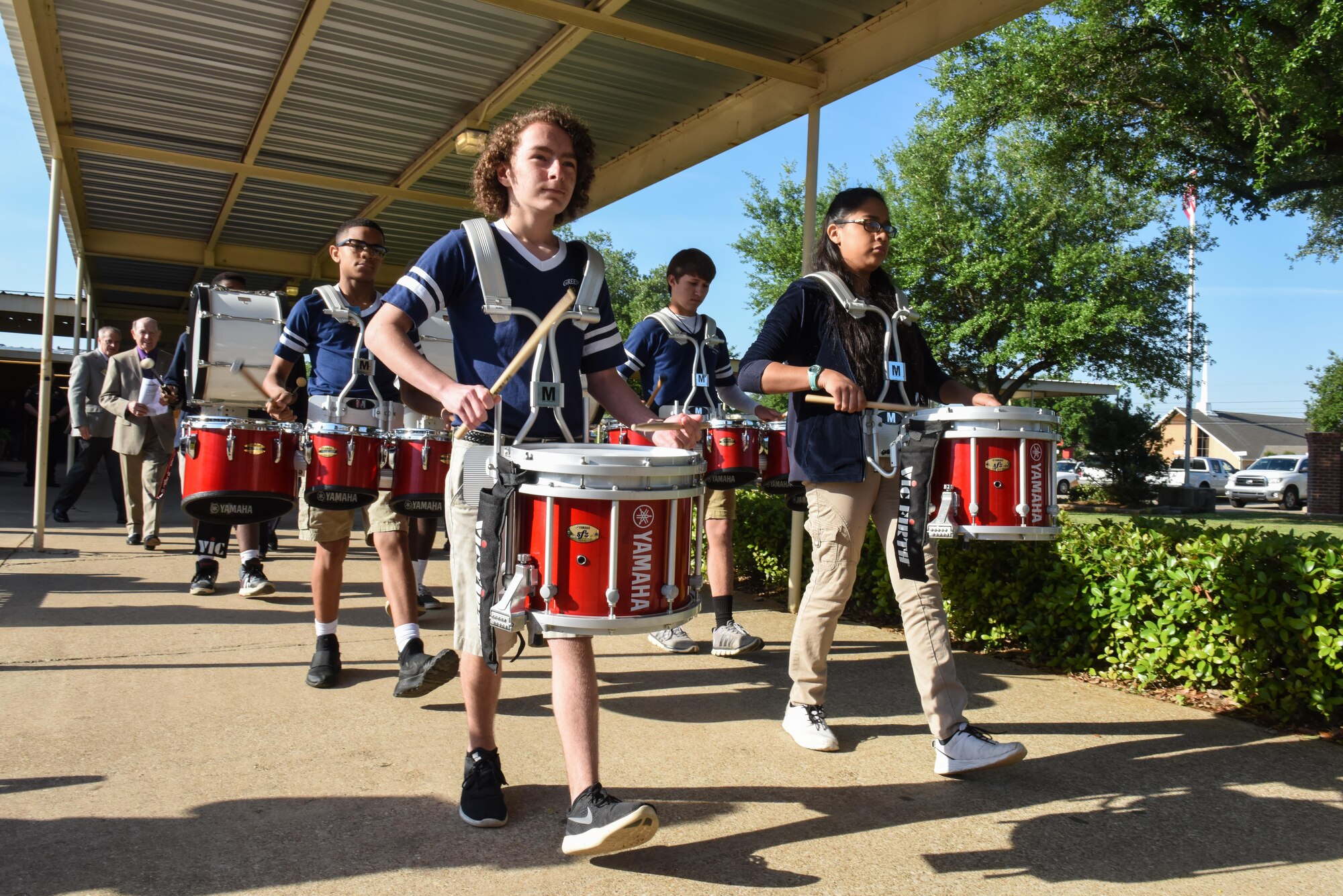 The Green Acres Middle School drumline leads military children in a parade during Purple-Up Day in Bossier City, La., April 7, 2017. The parade gave recognition to military children and the sacrifices they make. (U.S. Air Force photo/Senior Airman Luke Hill)