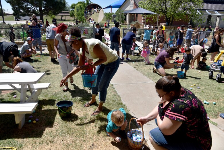 Children hunt for eggs at the Easter Egg Hunt near the school age program area on Goodfellow Air Force Base, Texas, April 8, 2017. The hunt had 5,200 eggs for the children to find. (U.S. Air Force photo by Staff Sgt. Joshua Edwards/Released)