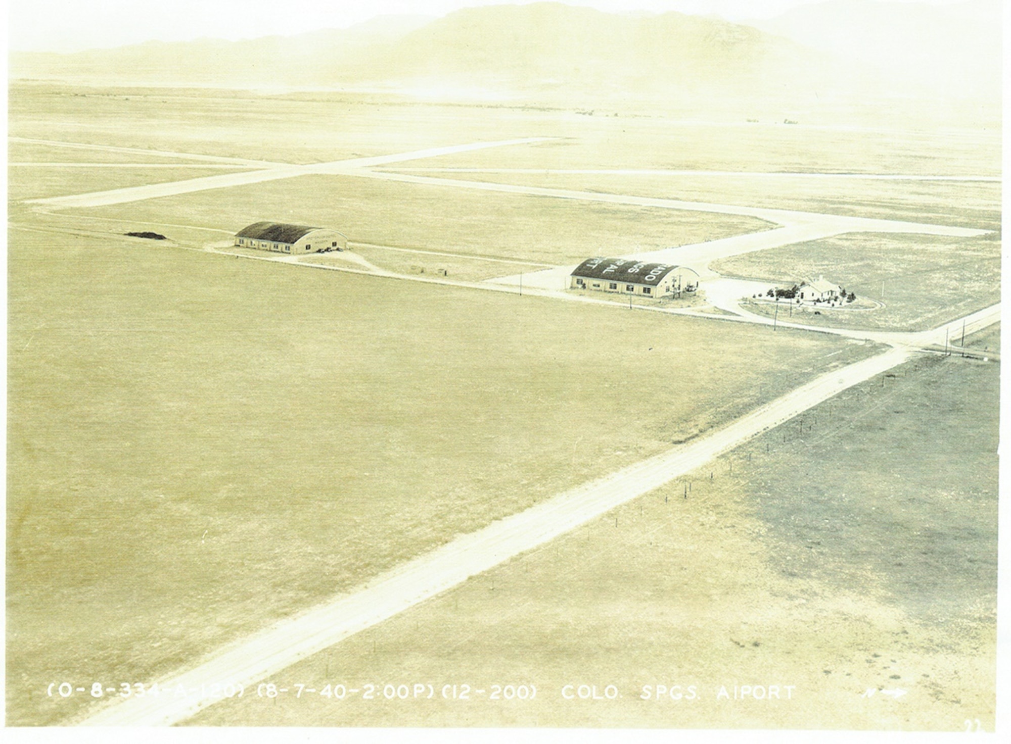 PETERSON AIR FORCE BASE, Colo. – The Colorado Springs Airport complex, in 1929, consisted of two short gravel runways with lights, two public hangers, and the Spanish House. First built in 1929, the Spanish House originally served as an office, full-time superintendent residence, and temporary lodging for stranded pilots and passengers. (Courtesy photo) 