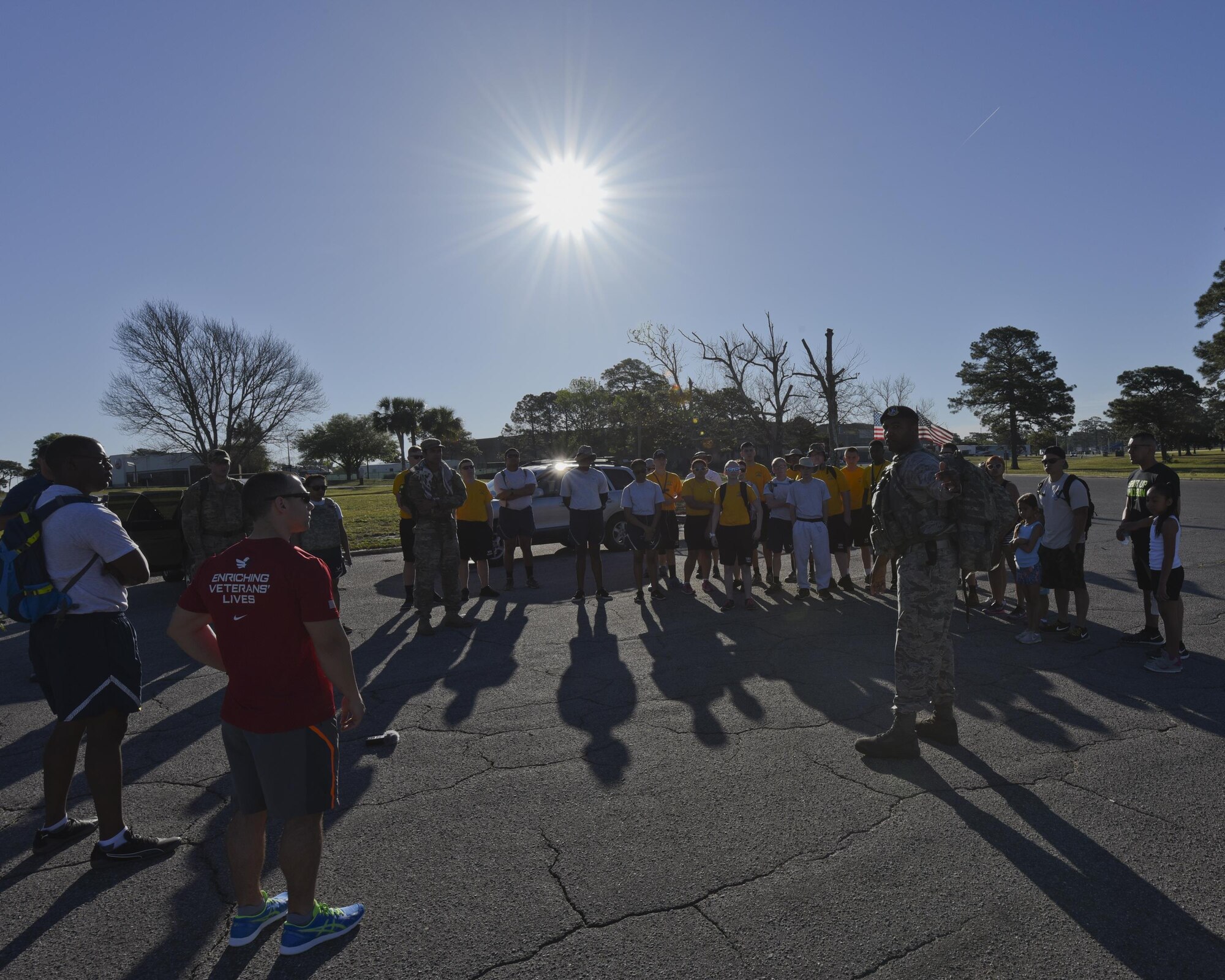 U.S. Air Force Staff Sgt. Cameron Culliver, 325th Security Forces Squadron fleet management NCO in charge, gives members of the Rutherford High School Junior Reserve Officer Training Corps and volunteers of Bataan Death Memorial March instructions for the event path at Tyndall Air Force Base, Fla., March 31, 2017. Rutherford High School JROTC cadets and active duty military members came together to honor the fallen and surviving members of the 1942 Bataan Death March that claimed thousands of lives. (U.S. Air Force photo by Senior Airman Solomon Cook/Released)