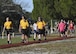 Cadets of the Rutherford High School Junior Reserve Officer Training Corps, their parents and Tyndall Airmen, walk down the Beacon Beach path at Tyndall Air Force Base, Fla., March 31, 2017. After the conclusion of the 14-mile ruck march, the cadets became eligible for the new JROTC Bataan Death March ribbon. (U.S. Air Force photo by Senior Airman Solomon Cook/Released)