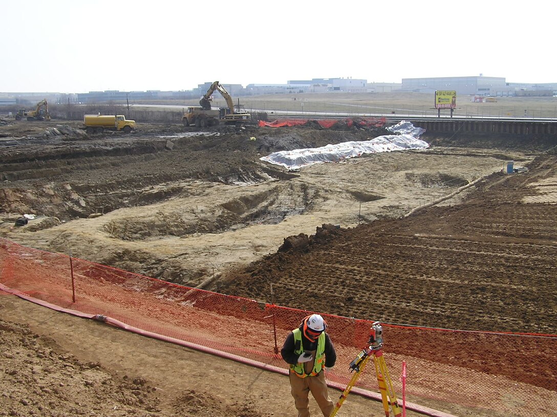 Progress is being made at the St. Louis Airport Site Tuesday, March 7, 2006. In 1997, an Engineering Evaluation/Cost Analysis (EE/CA) developed by Department of Energy proposed the removal of radioactive contaminated materials immediately adjacent to Coldwater Creek (CWC) at the West End of the St. Louis Airport Site next to the gabion wall and shipped to a licensed out-of-state disposal facility. The remainder of SLAPS was remediated in accordance with the North County Record of Decision, which was issued in September 2005. More than 600,000 cubic yards of radiologically contaminated material was removed from SLAPS over a nine-year period.  A formal closing ceremony took place May 30, 2007.