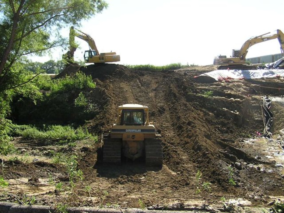 Workers conduct remedial activities on one of the St. Louis Airport Site Vicinity Properties.