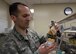 Tech. Sgt. Manuel Painter, 92nd Aerospace Medicine Squadron dental technician, displays a casting of a complete set of teeth, fixed into a jaw simulating apparatus April 07, 2017, at Fairchild Air Force Base, Wash. Creating positive molds of teeth helps dentists and technicians see how teeth will fit together. (U.S. Air Force photo/A1C Ryan Lackey)